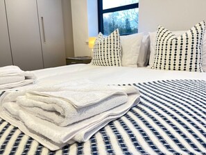 Our spacious bedroom offers a luxurious king-size bed for ultimate comfort, with the added option to be configured as two single beds to suit your needs. 