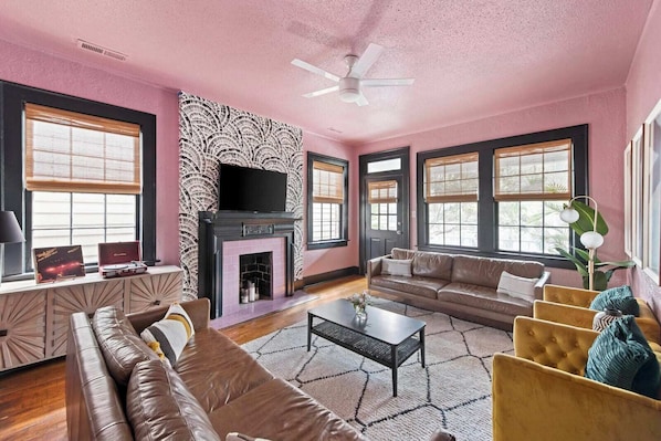 Welcome to your downtown Charleston rental! Explore all things downtown by foot! Spacious living room with seating for your entire group!