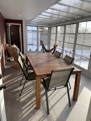 Sunroom with adjustable screened windows