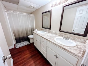 Bathroom stocked with essentials, including a spacious vanity.