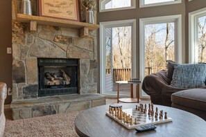 Enjoy time with family and friends as you cozy up by the fireplace after fun on the lake