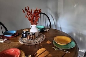 The kitchen table seats 4, but there is room to pull up an addition chair or two.