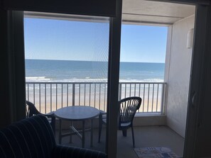 Admire the beach and ocean view from the balcony. 