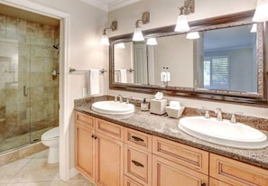 Bathroom 1: dual sinks and walk-in shower