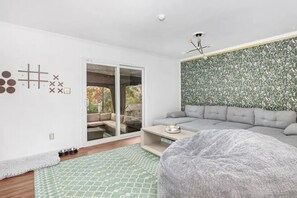 A cozy lounge area with a 65 inch Roku TV