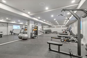 Communal Area: Gym offering a wide range of workout equipment and a smart TV.