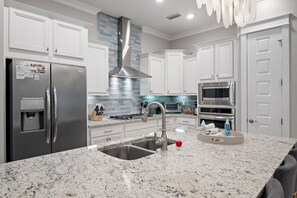 Kitchen with Big Island: Sleek, modern kitchen with a large island perfect for meal prep and gathering.