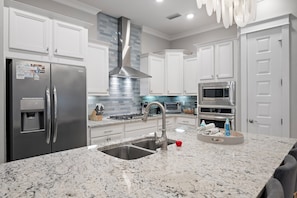 Kitchen with Big Island: Sleek, modern kitchen with a large island perfect for meal prep and gathering.