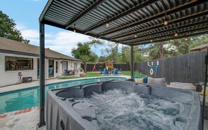 No need to go anywhere for happy hour – it’s tequila o’clock anytime you want at this tropical backyard pool oasis!