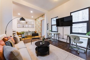 A pair of office desks providing a laptop-friendly workspace