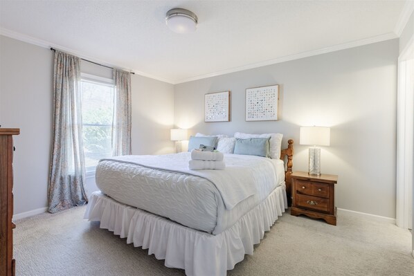 Master bedroom with a king bed.