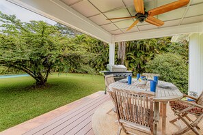 Villa's large shady lanai with grill, table, fan