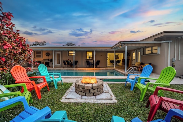 Stunning Pool | Fire Pit | Outdoor Oasis - Private pool surrounded by tropical greenery Cozy fire pit with colorful Adirondack chairs Perfect for sunset relaxation Just minutes from Hollywood Beach