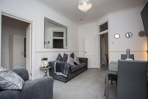 Experience the epitome of modern comfort and style in our chic dining room/living area. 
