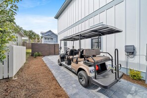 6-Seater Golf Cart with Audio Pkg on the Extended Driveway by the Side of the House