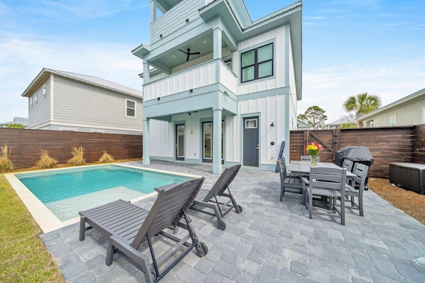 Pool with Lounge Chairs, Table/Chairs, Grill, and Deck Box with Pool Toys inside