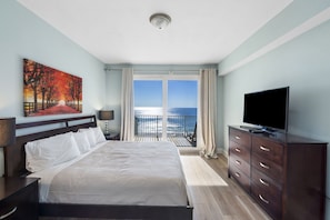 Primary Bedroom with Ocean Views, King Size Bed, Flat Screen TV, Ensuite Bathroom and Private Balcony Access