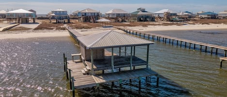 located on the bay, with a white sandy beach
