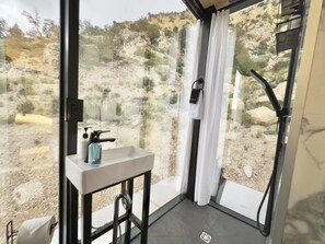 When you stay in one of our mirror homes at East Zion Resort, you will have your own, private, modern bathroom with shower.  The mirrored glass provides privacy during the day and curtains provide the privacy at night.