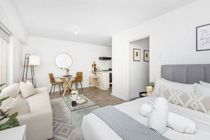 Enjoy the spacious living room with a dining area and comfortable seating.