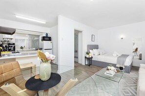 Settle into this awesome studio, complete with a kitchenette, a comfortable seating area, and a relaxing bed.