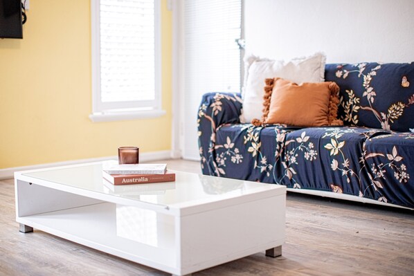Gather around the coffee table and enjoy a cup of coffee or engage in conversation with loved ones.