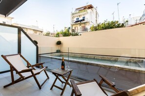 Savor your drink on the veranda while gazing upon the pool