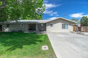 Private front yard with covered entry.