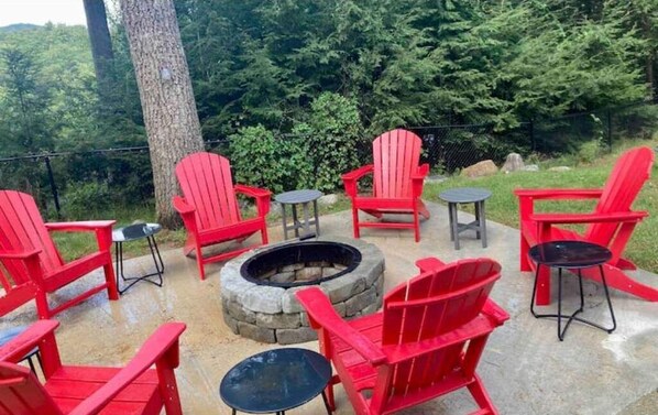 Newly constructed fire pit area with plenty of seating right in front of jacuzzi