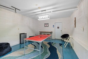 Fill up the mini fridge and have some fun in this game room/bar area!
