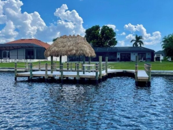 Dock that goes out 40’ into the lake & that houses up to a 36’ boat w/ Tiki Hut