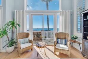 Living room: large comfy sofa, ocean views, smart TV with cable, direct access to the front porch