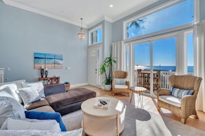 Living room: large comfy sofa, ocean views, smart TV with cable, direct access to the front porch