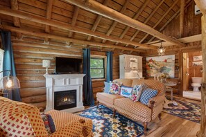 Comfy couch/chair, faux fireplace and smart tv!