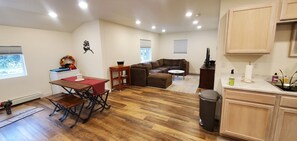 Large cozy couch, lots of natural light. Large TV with Roku