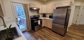 All new appliances and back porch with a gas BBQ grill