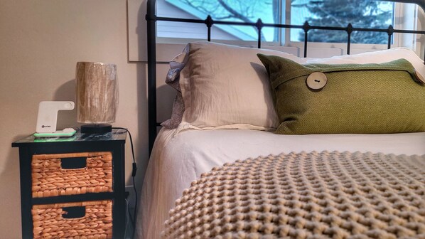Gentle colors and textures of the master bed Queen