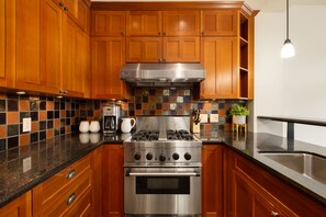 Gourmet kitchen with granite counters, and stainless-steel appliances