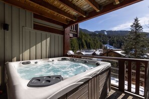 Lower hot tub deck with slope and gondola views