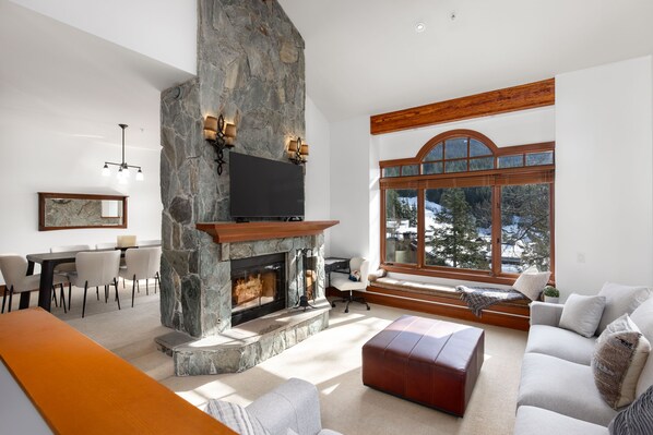 High vaulted ceilings and large windows with stunning views of Whistler mountain