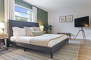 Retreat to our master bedroom, a haven of tranquility and style for a restful night's sleep.