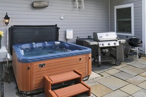 Bubbling hot tub and grill area