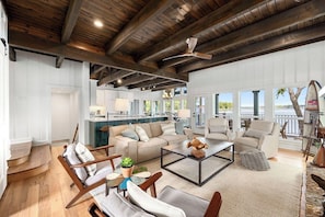 Upon entering the house, there is an open concept living, dining, and kitchen space.