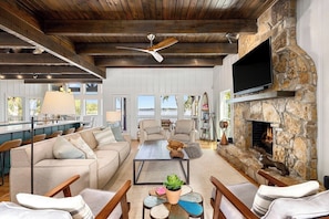 Lots of comfy seating options, TV with Netflix and YouTube TV, and a cozy fireplace for the cooler months.