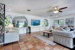 Stylish Living Room with plenty of seating, huge TV, Karaoke machine & more!