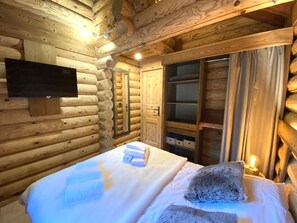 Bedroom with double bed and TV
