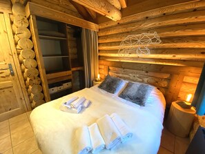 Bedroom with double bed and TV