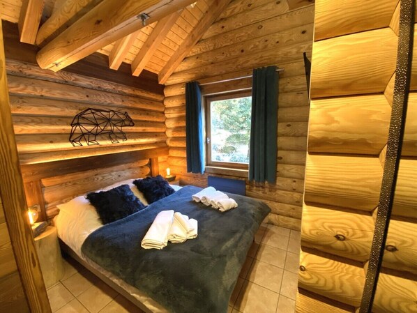 Bedroom with double bed and TV
