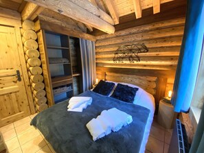 Bedroom with double bed and TV