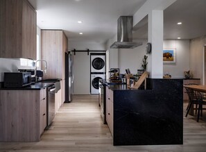 In the kitchen at Pitchner Place, culinary magic awaits. Equipped for every need, it's perfect for crafting meals with locally sourced produce. Here, you'll cook up not just dishes but also memories of your adventures in Central AZ
